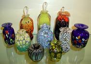 Blown Glass Perfume bottles were produced with varied color techniques: reduction, millifiores, frits, and threads.  All perfume bottles come with stoppers.