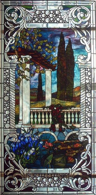 The design in this window is based off of a Tiffany window. A special feature about this design is that there is triple plating over the water to add depth. This window measures approximately 3'x6'