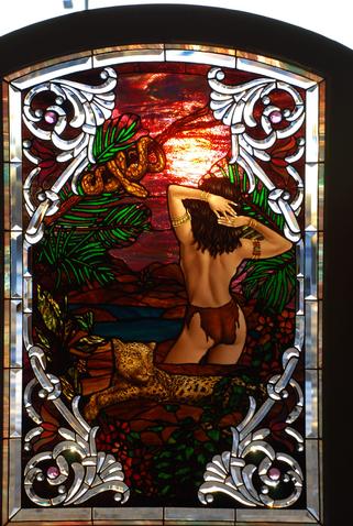 Aziza, the powerful and beloved jungle maiden, is depicted in this stained glass and bevelled work by Bogenrief Studios of Sutherland, Iowa.